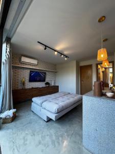 a bedroom with a large bed in a room at Casa Villa Kamai 01 in São Miguel dos Milagres +11 photos