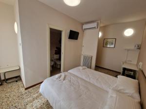 Albergo D'Ambros - Casa Belfiore Group客房内的一张或多张床位