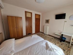 Albergo D'Ambros - Casa Belfiore Group客房内的一张或多张床位