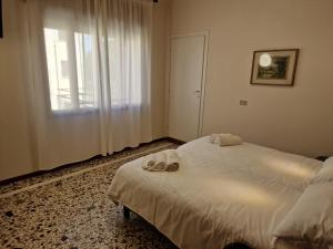Albergo D'Ambros - Casa Belfiore Group客房内的一张或多张床位