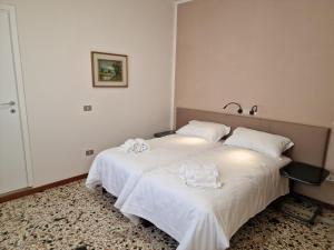 Albergo D'Ambros - Casa Belfiore Group客房内的一张或多张床位