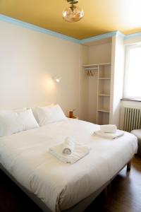 Postel nebo postele na pokoji v ubytování Hotel Bleu Soleil