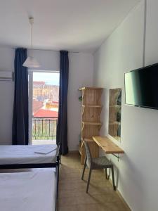 Postel nebo postele na pokoji v ubytování Mary Studios