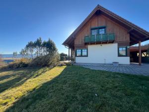 a house with a large yard in front of it at Haus am Ring in Spielberg