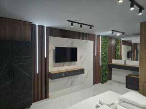 TV a/nebo společenská místnost v ubytování Hotel Villa Nadin