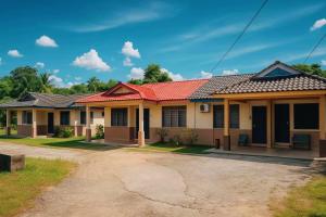 a house with a red roof at Wawa Homestay Bandar Jeli - 2 in Jeli