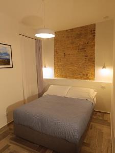 Letto o letti in una camera di Il Rifugio del Borgo