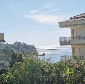a view of the ocean from a building at Alice Apartment in Tropea