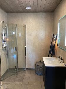 a bathroom with a shower and a sink at Cabin at Norefjell! Perfect for families with children in Runn