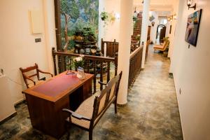 a hallway with a table and chairs in a building at Dutch Wall Fort in Galle