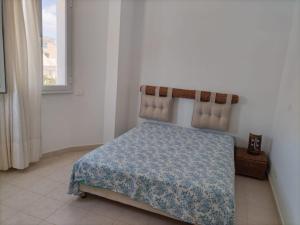 Ένα ή περισσότερα κρεβάτια σε δωμάτιο στο Apparemment Kelibia
