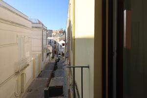 a view of a city street from a window at "CasaMia" Apartment - Brindisi Historic Center in Brindisi