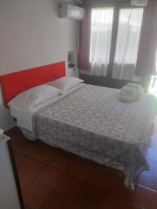 Posteľ alebo postele v izbe v ubytovaní Le Rocce Holiday Rooms