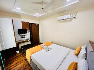 Letto o letti in una camera di Shankar Bhavan By Vinayak Hotels