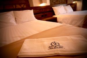 Ένα ή περισσότερα κρεβάτια σε δωμάτιο στο Hotel Villa de la Parra