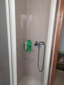 a bathroom with a shower rack in a bathroom at Apartamento Junto AL MAR Quesada 2 in Almería