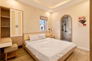 Postel nebo postele na pokoji v ubytování Sunshine Beach Villa - Novaworld Phan Thiết