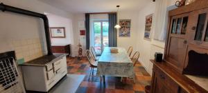 a kitchen with a table and a stove at Fast wie zu Hause in Jettingen-Scheppach