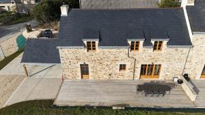 an overhead view of a house with a deck at 2 gîtes à la campagne, proche mer, 18 personnes in Landévant