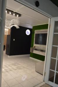 a view of a room with a clock on the wall at Casa Clemente Vacation Rentals in Carolina