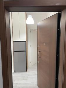 an open door to a room with a hallway at Marina in Shëngjin