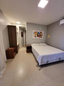 Postel nebo postele na pokoji v ubytování Hotel Golfinho
