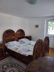 a bedroom with a bed and a table and a window at Apartment in centre of Milna in Milna +24 photos