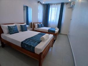 Postel nebo postele na pokoji v ubytování Loki's Homely Haven