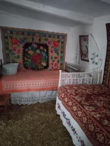 a bedroom with two beds in a room with hay at Дибинецькі Карпати in Dybintsy