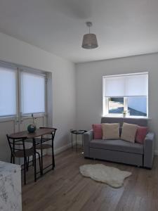 a living room with a couch and a table at Bradstone Lodge in Dundalk