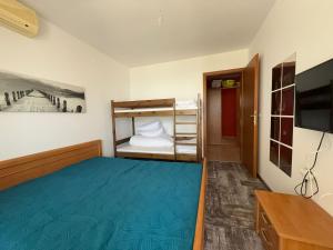 Postel nebo postele na pokoji v ubytování Beach Gate