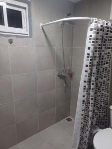 a bathroom with a shower with a shower curtain at Con Armonia in Santa Rosa