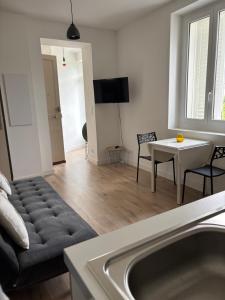 a living room with a couch and a table at Straboni corte in Corte