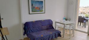 a living room with a chair and a table at Terrazza mare e monti in Alba Adriatica +11 photos