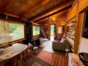 a living room with a couch and a table at RVilla in Pávliani +16 photos