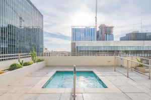 a swimming pool on the roof of a building at Sky Terrace DT HighRise, Gym, Pool, Parking, W-D,Golf in Phoenix
