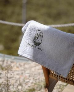 a towel that is sitting on top of a bench at SECRET HILL in Athani