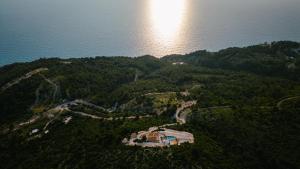 an aerial view of a house on a hill next to the water at SECRET HILL in Athani +22 photos