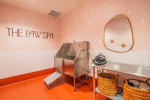 a dressing room with a sink and a mirror at Elegant 28th Floor High Rise, Gym, Parking, Pool, Golf in Phoenix