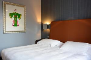 Postel nebo postele na pokoji v ubytování Hotel Moderno