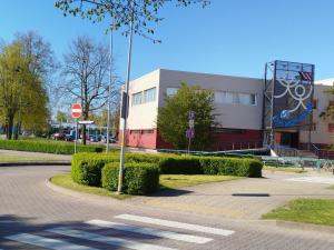 a building with a stop sign in front of a street at FourSpace in Ventspils