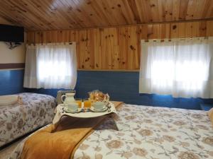 Postel nebo postele na pokoji v ubytování Hostal El Cartero