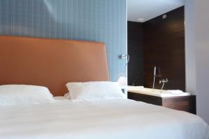 Postel nebo postele na pokoji v ubytování Hotel Moderno