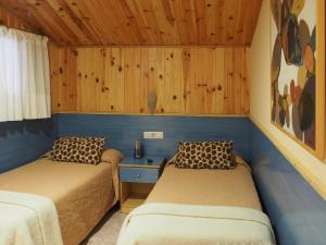 Postel nebo postele na pokoji v ubytování Hostal El Cartero