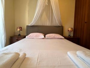 Postel nebo postele na pokoji v ubytování Sidis home flogita