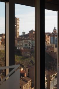 a view of a city from a window at Hostal El Cartero in Teruel
