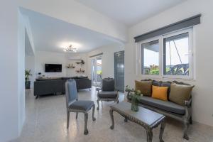 A television and/or entertainment centre at Villa Giota Luxury Living