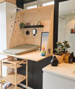a kitchen with a desk with a laptop on it at Lovely sea view in modern family house! in Steinkjer +21 photos