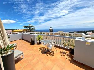Ein Balkon oder eine Terrasse in der Unterkunft La Casita del Arco Ático