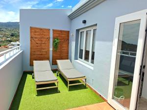 Ein Balkon oder eine Terrasse in der Unterkunft La Casita del Arco Ático